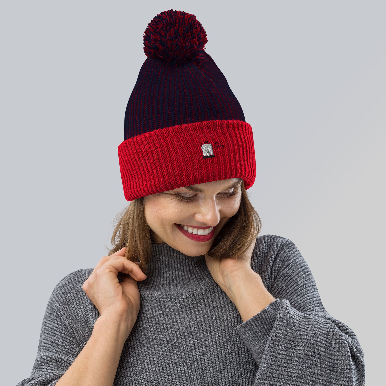 speckled-pom-pom-beanie-navy-red-front-64afeb3c1cf49.jpg